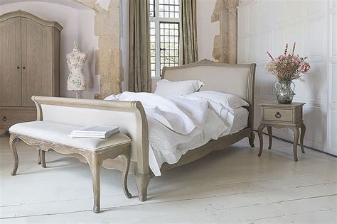 Wooden frame is finished with interesting pattern. Camille French Style Upholstered Bed - Crown French Furniture