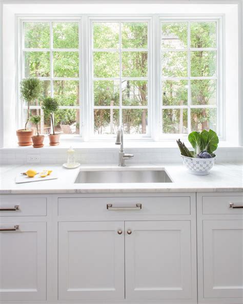 A lot of people like looking out of the window as they wash up. Calcutta Marble Countertops - Transitional - Kitchen ...