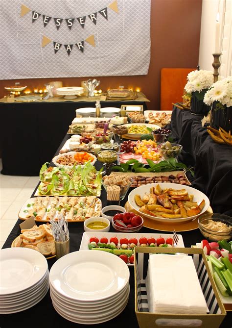A Buffet Table Filled With Lots Of Different Types Of Food And Drinks