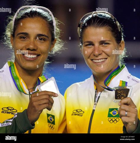 brazil s juliana silva and larissa franca r pose on the podium with their gold medals for the