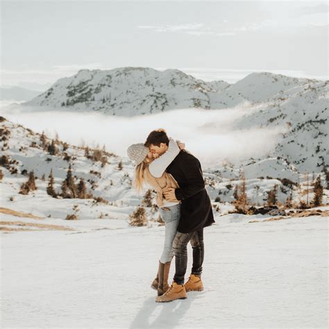 Taking Photos Of Couples In Love On The Top Of A Mountain With Snow