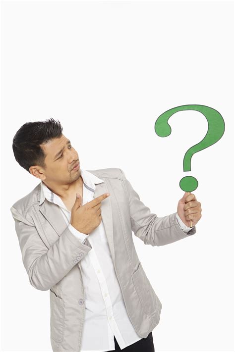 Man holding up a question mark symbol | Perfect Path Blog - Your ...