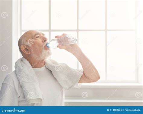 Thirsty Senior Man Drinking Water From Bottle Stock Image Image Of
