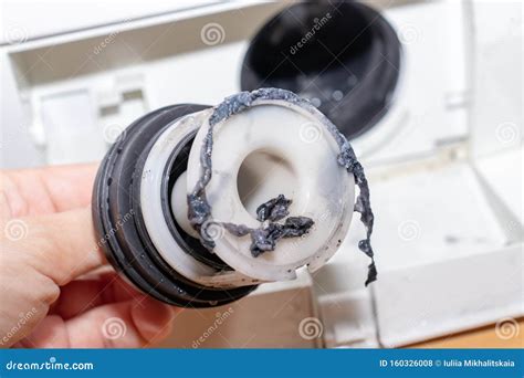 Inspecting Washing Machine S Dirty Clogged Drain Pump Filter Close Up