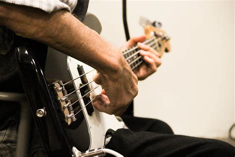 Free Stock Photo Of Close Up Of Man Playing Bass Guitar