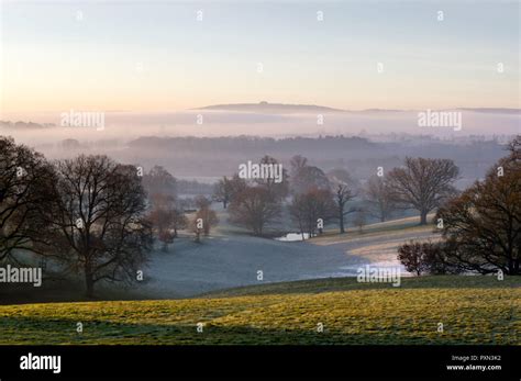 Sunrise Over The English Countryside On A Misty Winters Day Looking