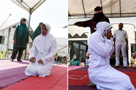 Harrowing Moment Sobbing Muslim Woman Covers Her Face As She Is Whipped