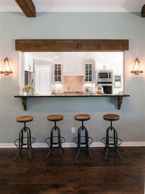 By opening the wall and allowing the sightlines to expand beyond the kitchen, you create the perception of more space without the cost of creating more square footage. A section of wall between the kitchen and living room was ...