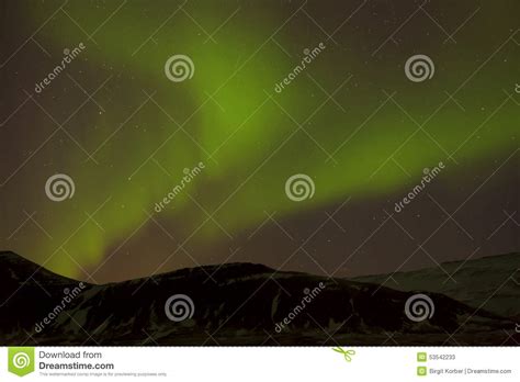 Northern Lights With Snowy Mountains In The Foreground