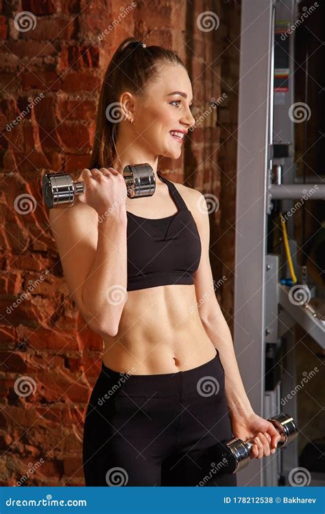 Sporty Attractive Fitness Woman With Dumbbells In Gym Trained Female Body Stock Photo Image