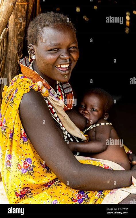 Woman From The Toposa Tribe Breastfeeding Her Baby Eastern Equatoria