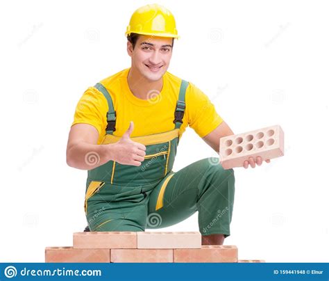 The Handsome Construction Worker Building Brick Wall Stock Photo