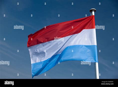 Dutch Flag Flying On Flagpole Stock Photo Alamy