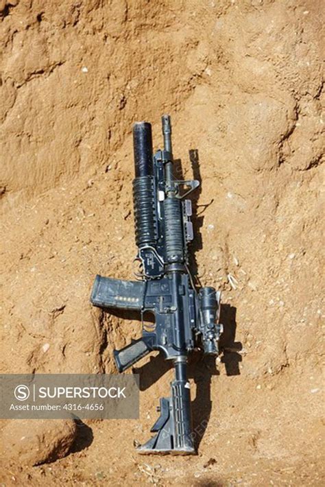 M4 Carbine Fitted With An M203 40mm Grenade Launcher Live Loaded At