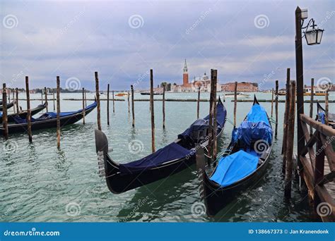 Gondolas And San Giorgio Maggiore Island In Venice Italy Editorial