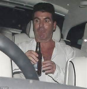 Simon Cowell Looks A Little Worse For Wear As He Enjoys A Night Out