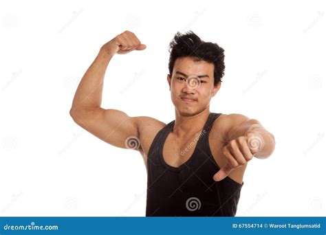 Muscular Asian Man Flexing Biceps And Thumbs Down Stock Photo Image