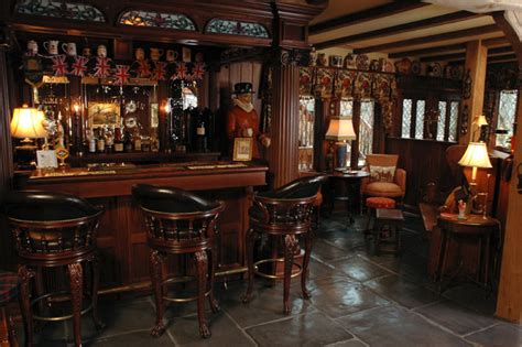 Even if you are not planning to bring a pool table and a gaming zone, you can still create the. English-Style Basement Pub - Traditional - Home Bar ...