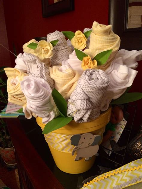 If you can't make something decorative entirely out of diapers for a baby shower then when else can you? Gray and Yellow Baby Shower decorations | Yellow baby shower decorations, Baby shower yellow ...