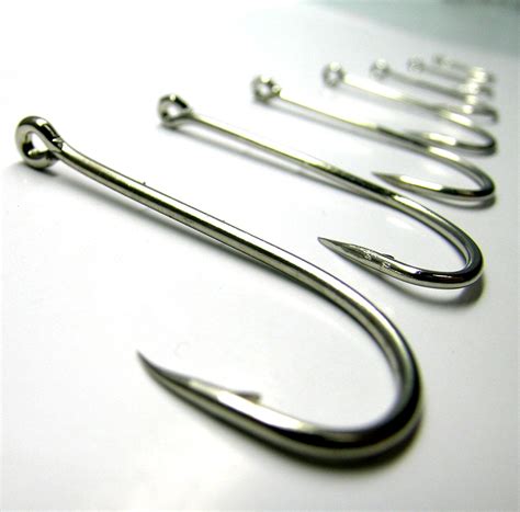 Filefishing Hooks On White Surface