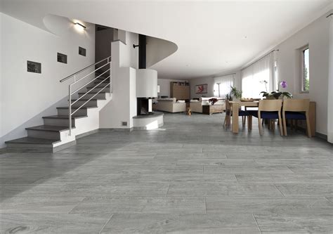 The popularity of greige and beige browns are seeing good demand along coastal areas or warmer regions that include florida. #Magnolia #Ash #gray #WoodInspired #floor - get this #InnovativeLook from #MidAmericaTile | # ...