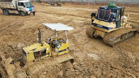 Bulldozers with Dump Trucks Operation push and Dumping soil | Machine