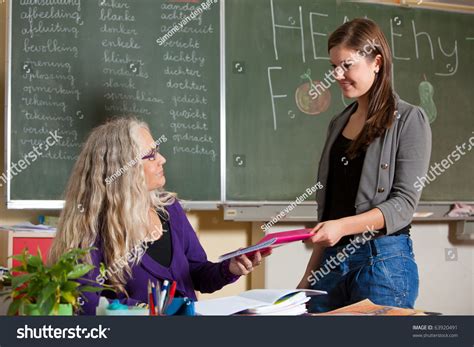 Student Giving Her Teacher Homework She Stock Photo 63920491 Shutterstock