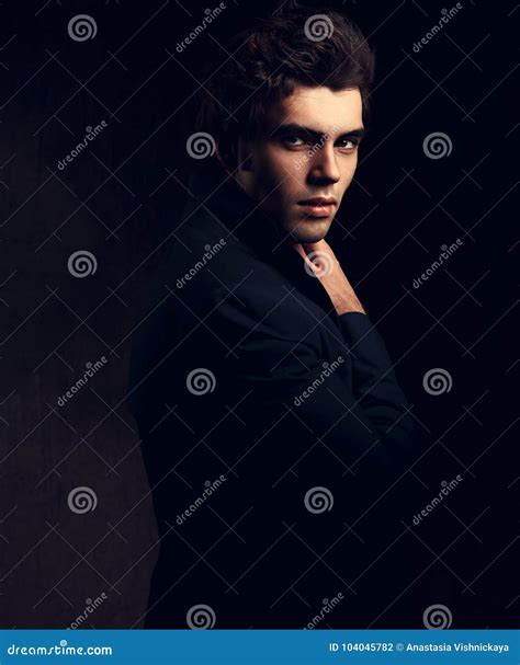 Handsome Charismatic Man Looking Serious In Dark Shadow Dramatic Stock