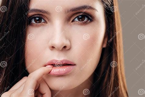 Young Woman Seductively Touching Finger To Lips Stock Image Image Of