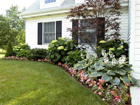 Small patches of garden beds around a yard can create nice paths in the grass so that people can walk between the patches of flowers and enjoy the flowers all. flower beds around house foundation | Landscape Design ...