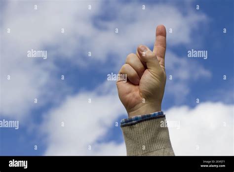 Man With Raised Index Finger Stock Photo Alamy