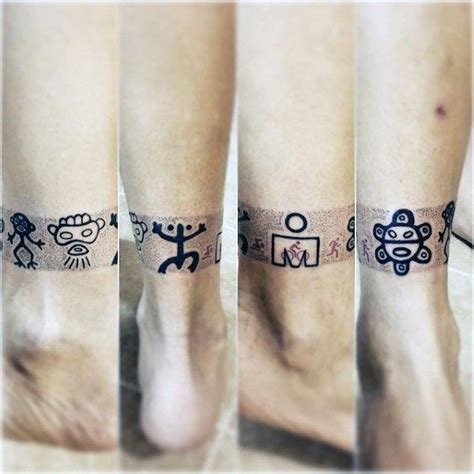 Leg Band Taino Symbols Tattoo On Guy Tattoosforguys Symbol Tattoos