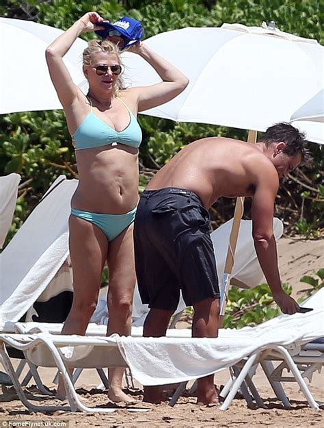 shirtless rob lowe and his bikini clad wife sheryl berkoff get stuck into selfie shoot daily