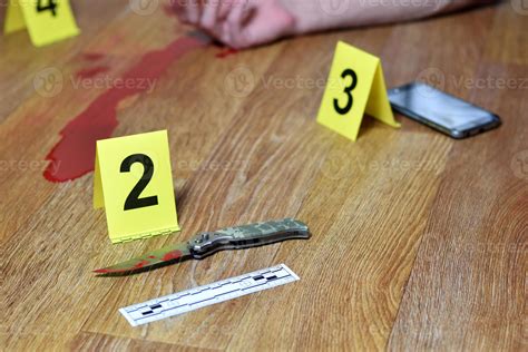 Crime Scene Investigation Bloody Knife And Victims Hand With Yellow