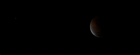As the earth passes between the sun and the moon, the moon is cast into shadow. Blood red lunar eclipse of the moon over north and south ...