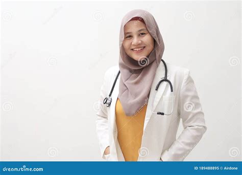 Beautiful Confident Asian Muslim Female Doctor Wearing Hijab Standing
