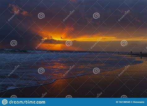 Beautiful Colorful Sunset At The Sea With Dramatic Clouds And Sun