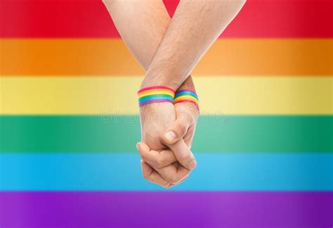 Hands Of Couple With Gay Pride Rainbow Wristbands Stock Image Image Of Male Pride 115591809