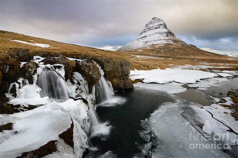 Waterfall And Kirkjufell Mountain In Winter Photograph By Tom Schwabel