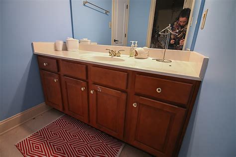 One way to refinish or update your bathroom vanity would be sand and then restain or paint the vanity in a new color. How to Refinish a Bathroom Vanity - Bower Power