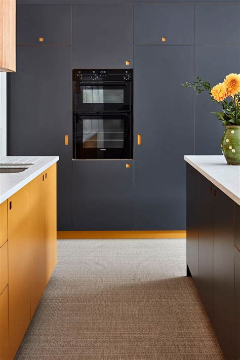 Most variations of gray, including muted and charcoal tones, work well with a range of oranges. Plywood kitchen cabinets | Modern kitchen furniture, Kitchen cupboard designs, Modern kitchen yellow