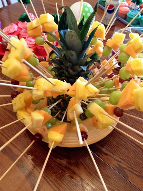 Tropical Themed Party Fruit Skewers In A Hollowed Out Pineapple