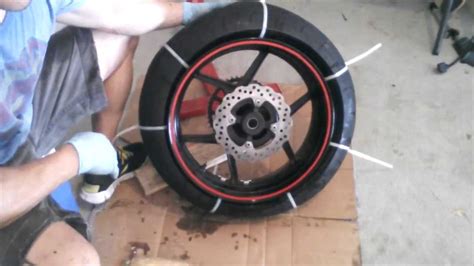 Im not sure how he gets the rim to fit through the tire so easly, i have tried windex, different angles ect. Motorcycle Tire Removal from Rim - Zip Tie Method- 2007 ...
