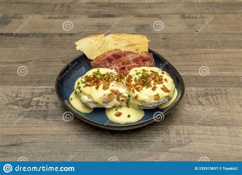 Eggs Benedict Anglo Saxon Dish With Two Halves Of An English Muffin