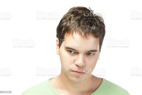 Portrait Of Sad Young Man Isolated On White Background Stock Photo