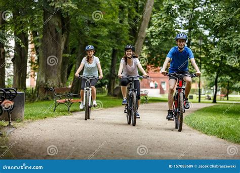 Healthy Lifestyle Happy People Riding Bicycles In City Park Stock Image Image Of Riders