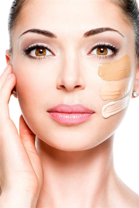 Beautiful Face Of Woman With Cosmetic Foundation On A Skin Stock Photo