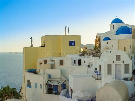 White Houses Churches And Blue Domes In Oia Village Editorial Stock