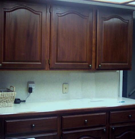 Remove cabinet doors, drawers, knobs, and hinges stain the cabinet fronts by applying gel stain on a sponge brush, with light and even strokes to avoid getting stain on the insides. oak cabinets stained dark | Dark wood kitchen cabinets ...