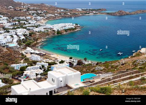 Platis Gialos And The Famous Psarou Beach At Mykonos Island In Greece
